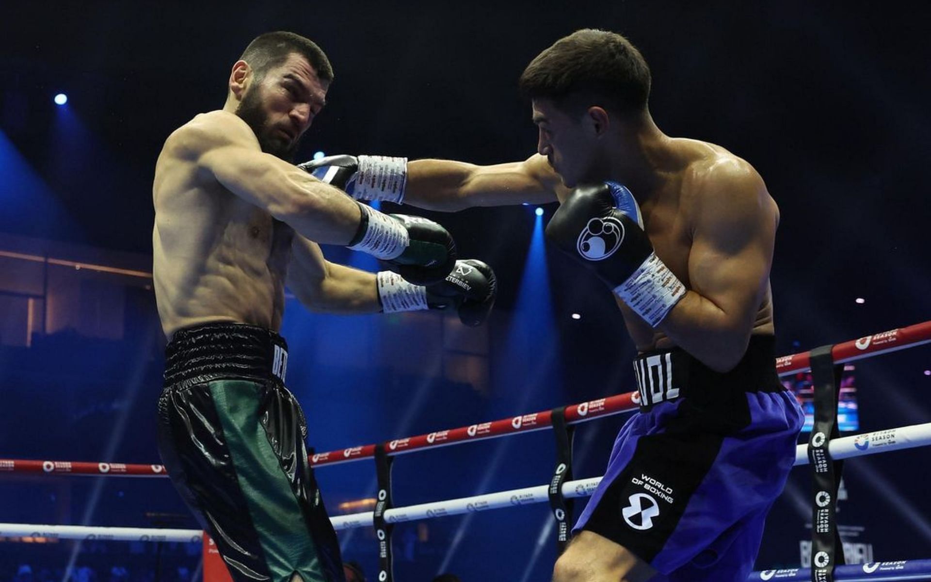 Artur Beterbiev (left) and Dmitry Bivol (right) in action during their bout. [Image courtesy: @matchroomboxing on Instagram]