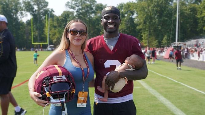 Seliana Carvalho celebrates as boyfriend Mike Sainristil intercepts Lamar Jackson