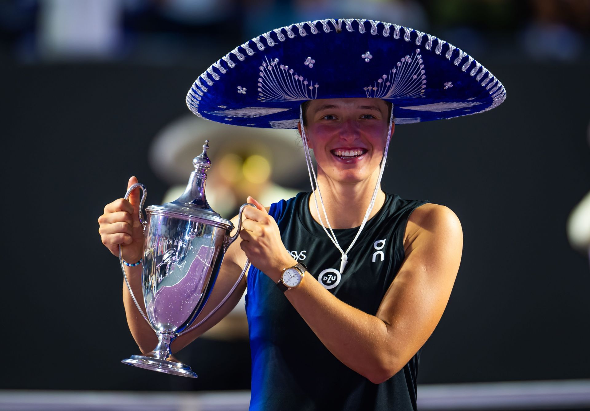 In Picture: Iga Swiatek holds the 2023 WTA Finals singles trophy (Image via Getty)