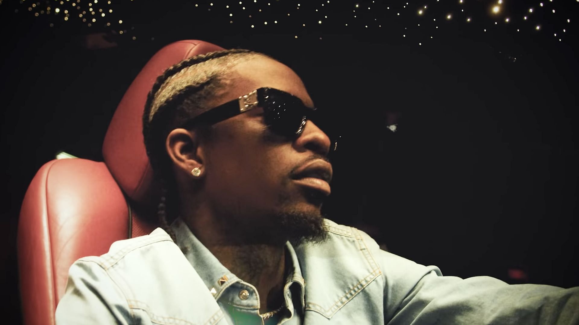 A screenshot from the music video for Rich Homie Quan