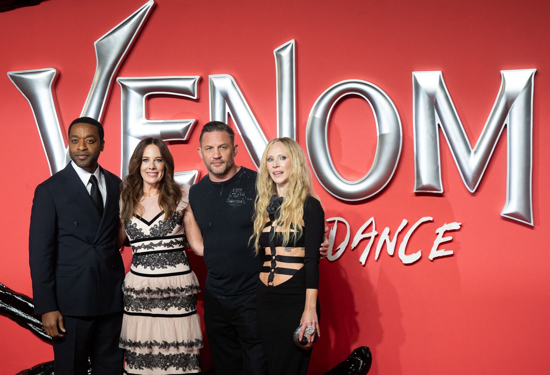 The cast of Venom: The Last Dance with writer/ director Kelly Marcel (Image via Getty)