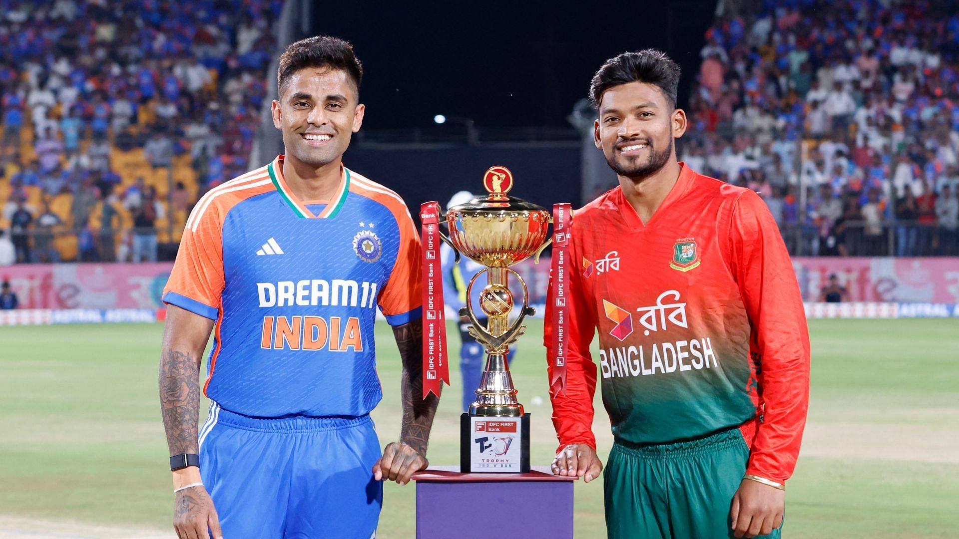 Captains Suryakumar Yadav (L) and Najmul Hossain Shanto (R) posing with the trophy (Image credits: BCCI)