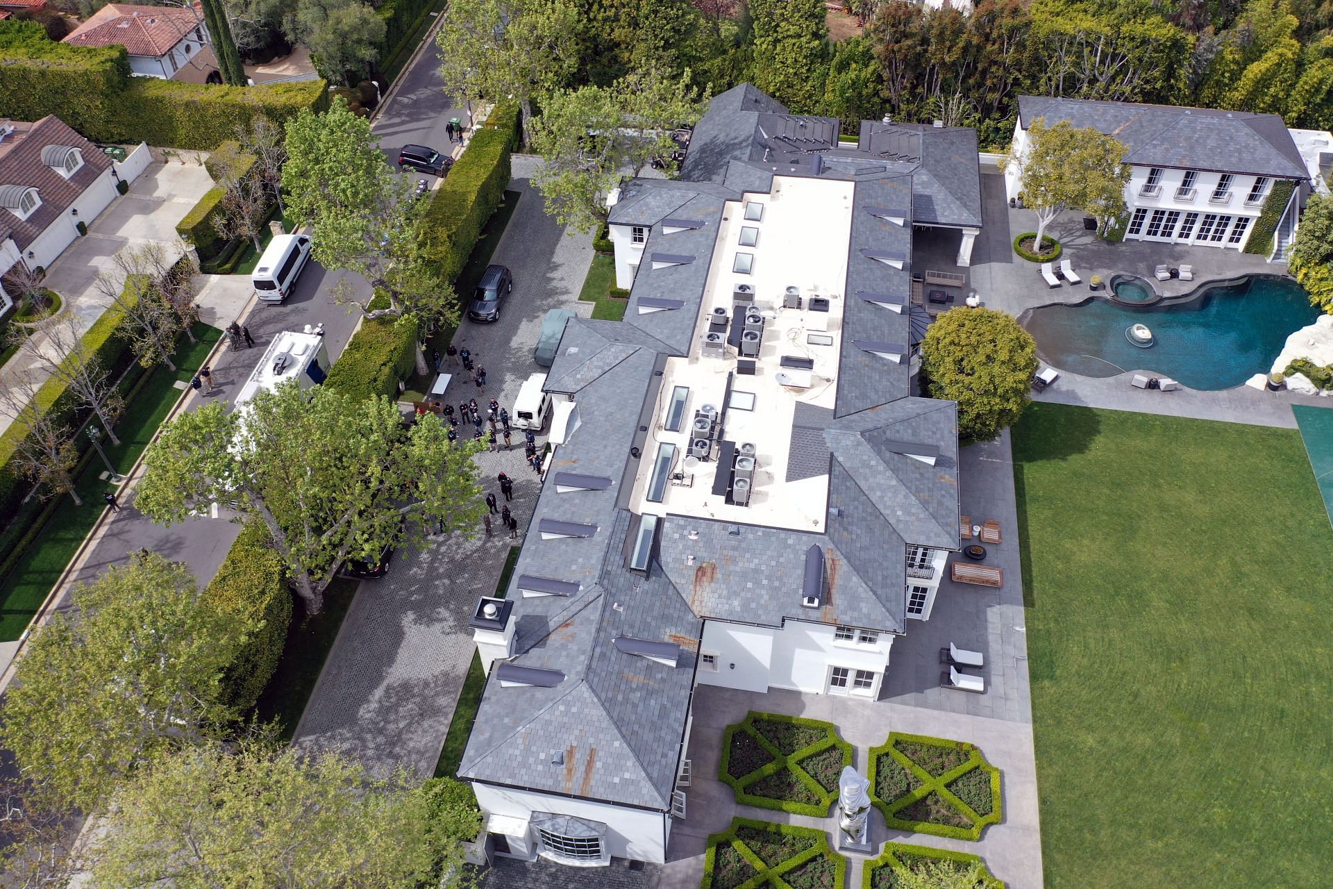 In an aerial view, the home of Sean &quot;Diddy&quot; Combs is seen during a raid by federal law enforcement agents on March 25, 2024 in Los Angeles, California (Image via Getty)