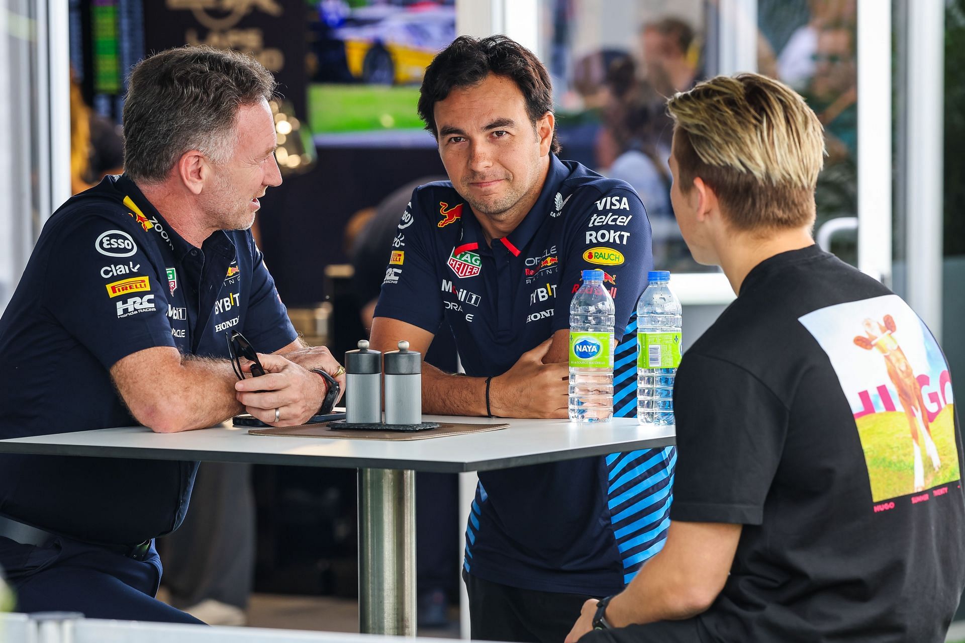 Red Bull&#039;s Christian Horner (L), Sergio Perez, and Liam Lawson (R) | Getty Images