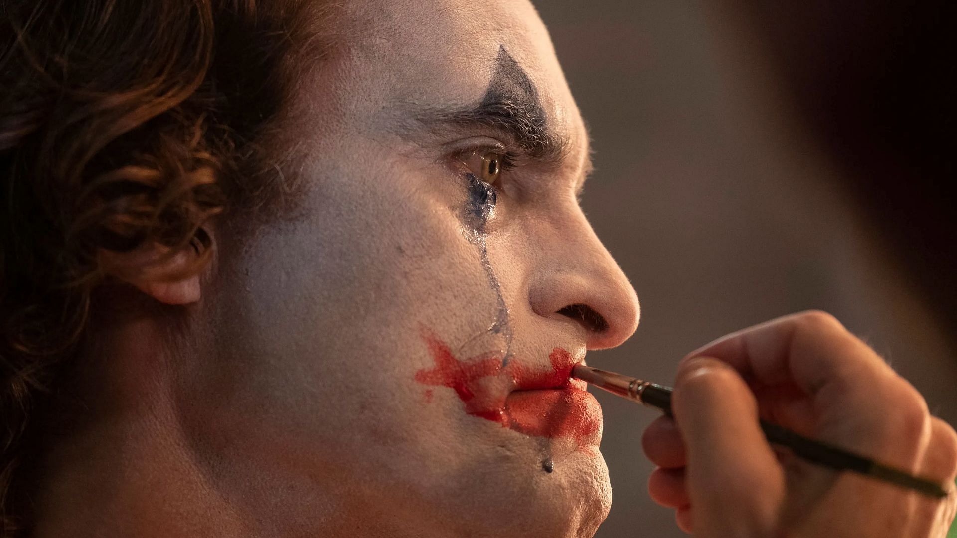 Joaquin Phoenix in a still from the Joker trailer (Image via YouTube/@WarnerBrosPictures)