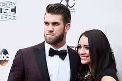 Bryce Harper's wife Kayla embraces 'cool mom' vibe in baseball cap and sweatshirt during a sweet stroll with daughter Brooklyn