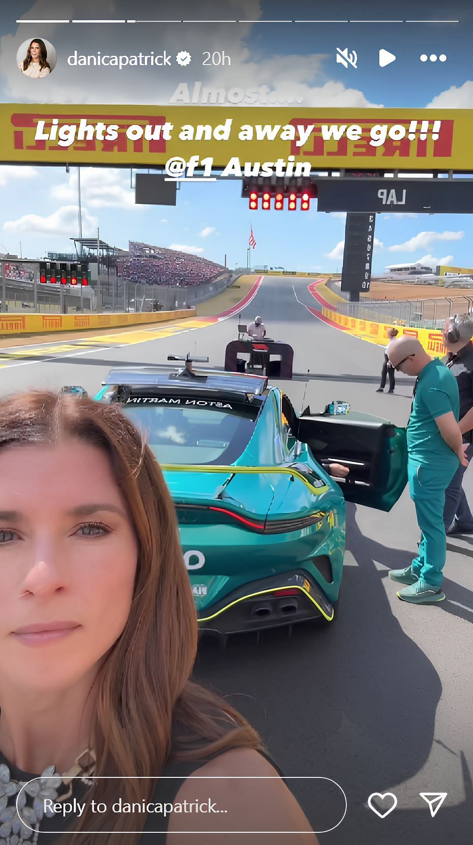 Patrick posing behind the F1 Safety car (Source: @danicapatrick on Instagram)