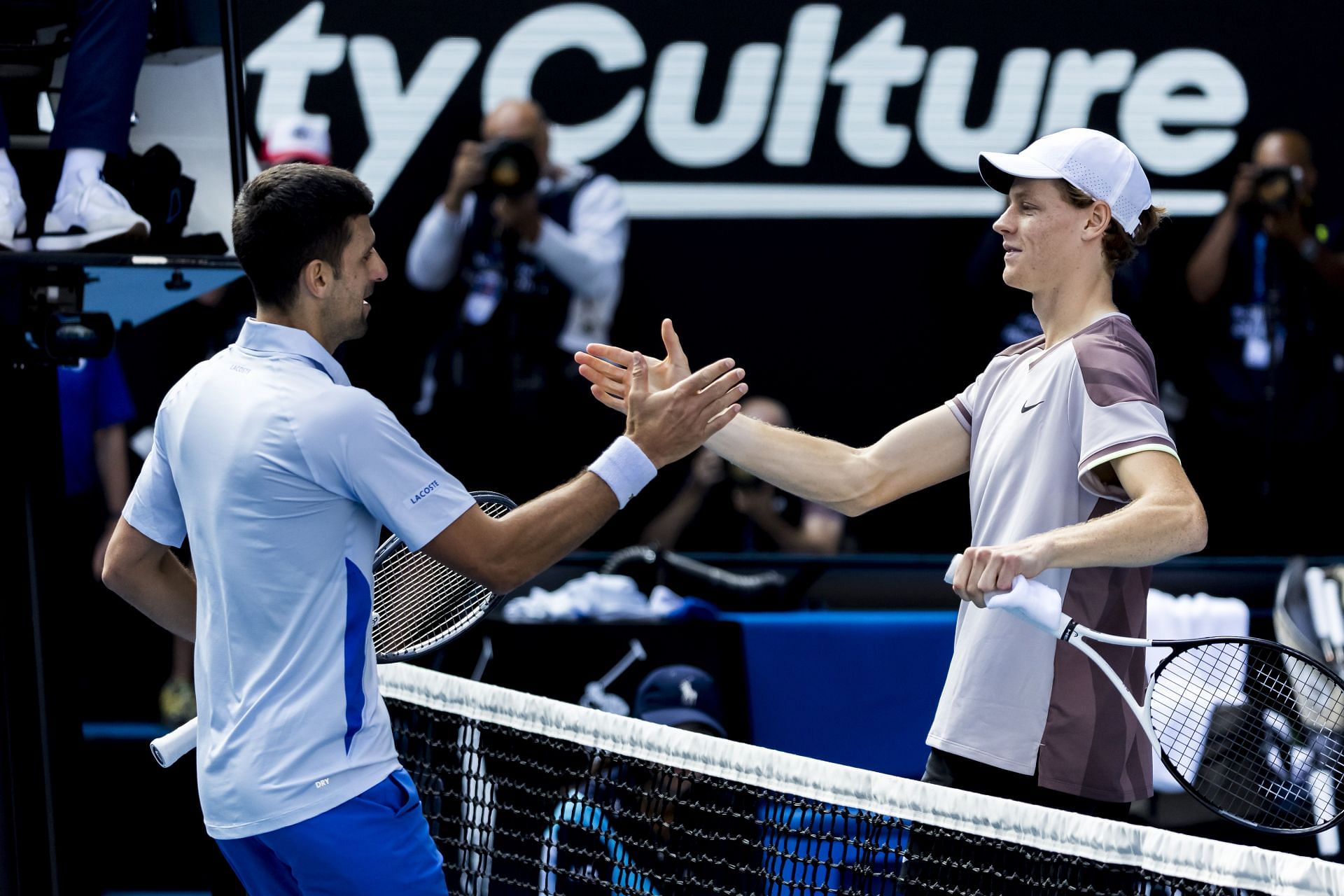 Novak Djokovic (L) and Jannik Sinner at the Australian Open (Image: Getty)