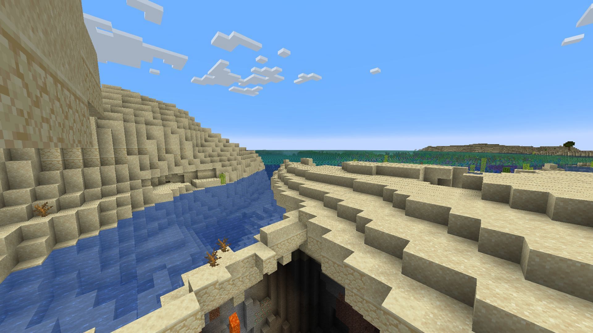 The hidden cave makes this one of the best Minecraft 1.21 beach seeds (Image via Mojang Studios)