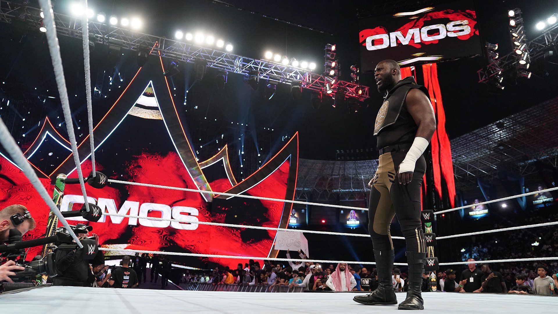 Omos stands tall inside the WWE ring