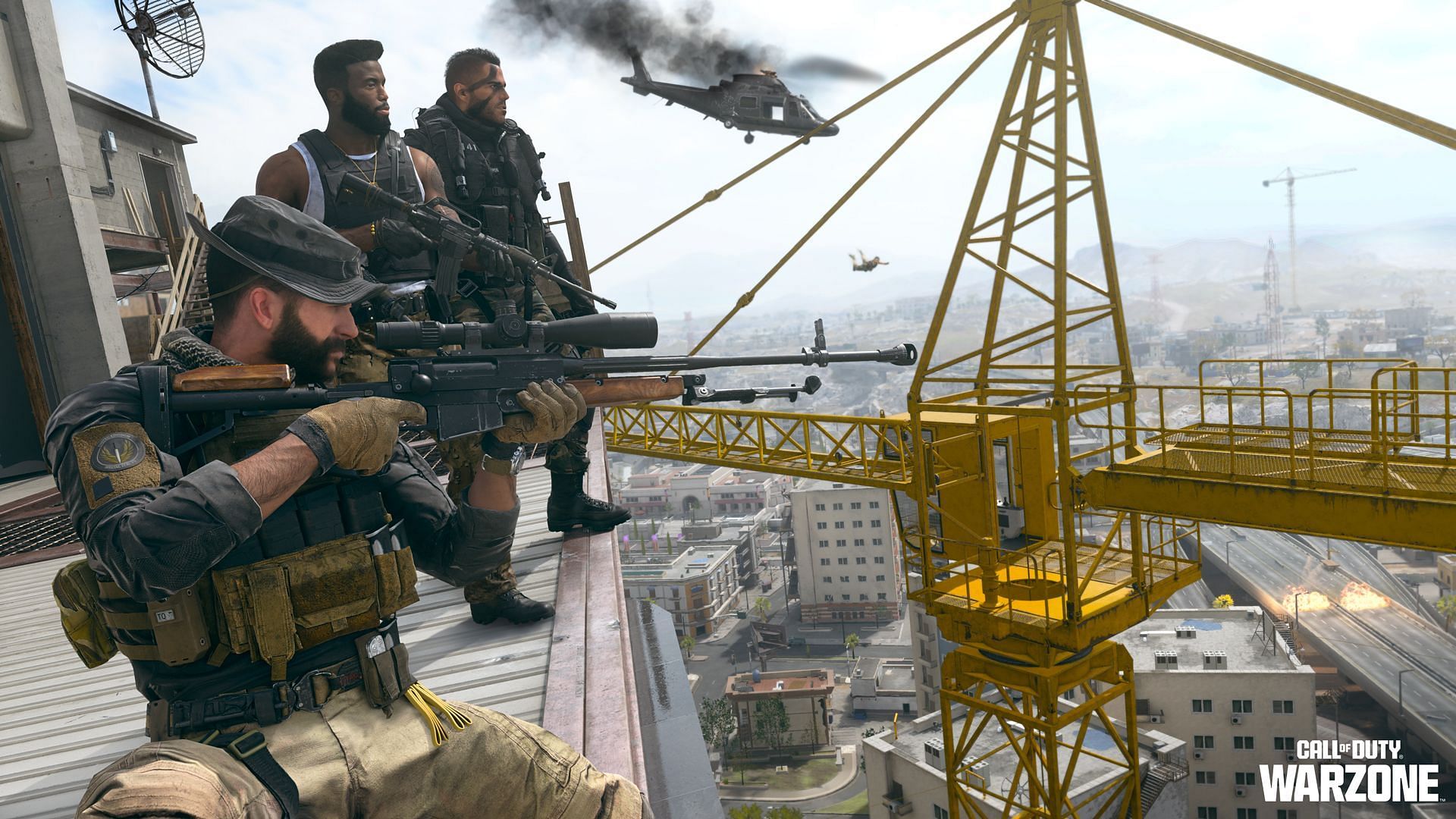 Three Operators in Warzone on top of a tower holding rifles