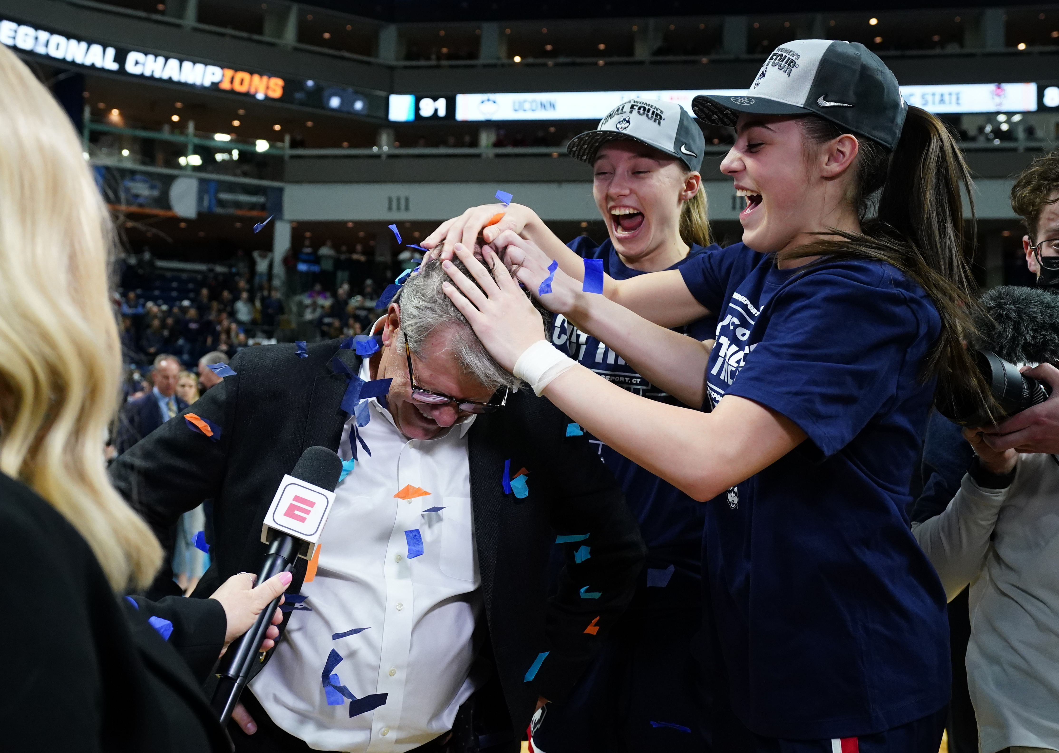 Nika Muhl and Paige Bueckers of UConn celebrating with Head Coach Geno Auriemma (NCAA Womens Basketball: NCAA Tournament-Bridgeport Regional-UConn vs NC State - Source: Imagn)