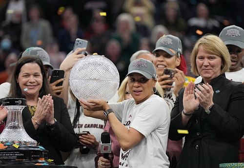 Coach Dawn Staley and the South Carolina Gamecocks celebrate their victory over the UConn Huskies in the 2022 Final Four championship game (Image via Imagn)