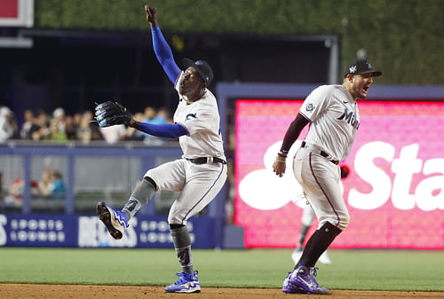 Former Miami Marlins - Jazz /Chisholm Jr. and Miguel Rojas (Photo via IMAGN)