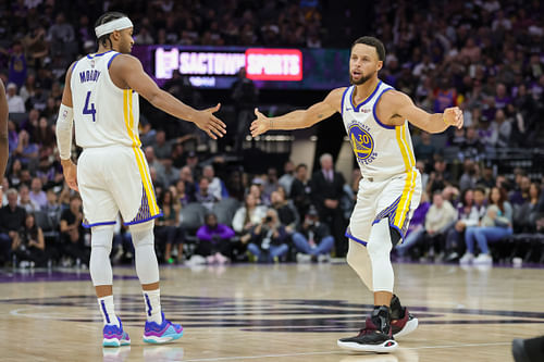 Golden State Warriors guard Steph Curry celebrates with guard Moses Moody against the Sacramento Kings at Golden 1 Center. Photo Credit: Imagn