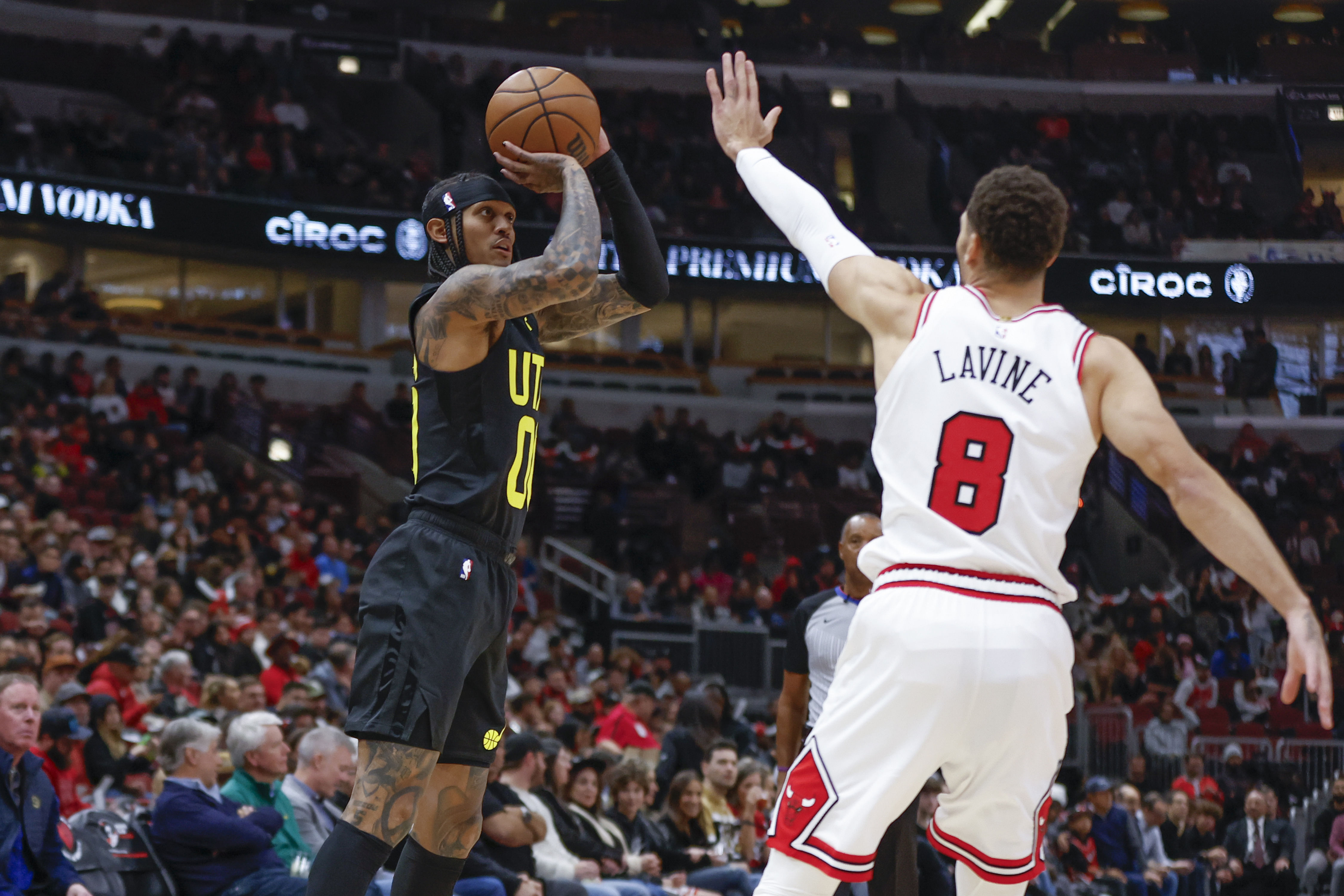 Zach LaVine attempts to block a shot from a Utah Jazz player (Credits: IMAGN)