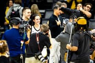 Caitlin Clark poses for a photo with Connor McCaffery after an NCAA Big Ten Conference women's basketball game against Michigan in Iowa City, Iowa. Source: Imagn
