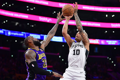 San Antonio Spurs forward Jeremy Sochan shoots against LA Lakers forward LeBron James at Crypto.com Arena. Photo Credit: Imagn