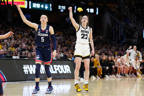 Paige Bueckers looks on as Caitlin Clark gets her shot up at NCAA Womens Basketball: Final Four National Semifinal-Connecticut vs Iowa - Source: Imagn