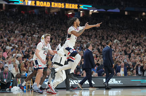 Connecticut Huskies guard Stephon Castle and Cam Spencer celebrate with teammates after defeating the Purdue Boilermakers in the 2024 NCAA Tournament at State Farm Stadium. Photo Credit: Imagn