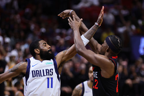 Dallas Mavericks guard Kyrie Irving defends against Miami Heat forward Jimmy Butler at Kaseya Center. Photo Credit: Imagn