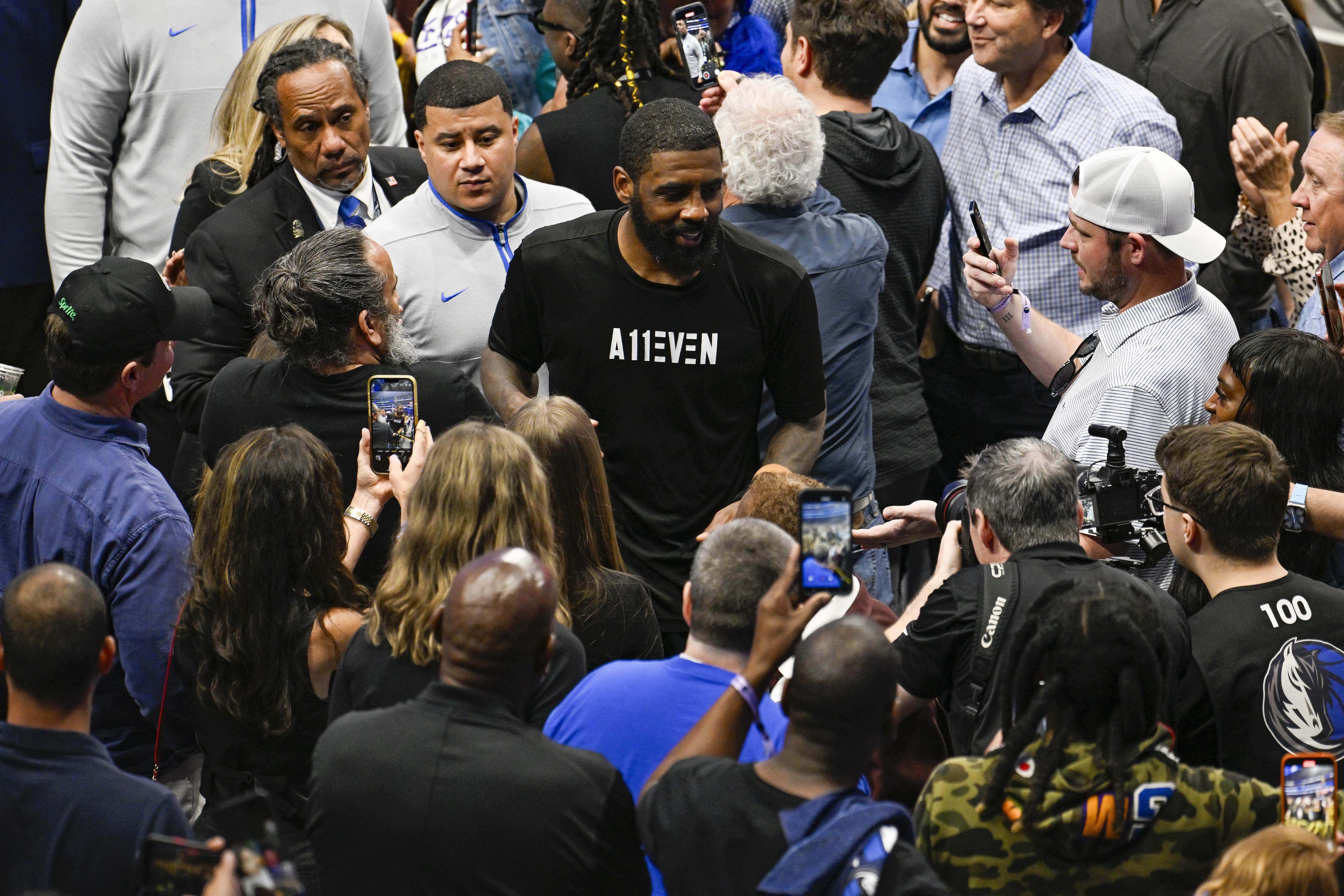 Dallas Mavericks guard Kyrie Irving celebrates with the fans as he leaves the court after the Mavericks defeat the LA Clippers at American Airlines Center. Photo Credit: Imagn