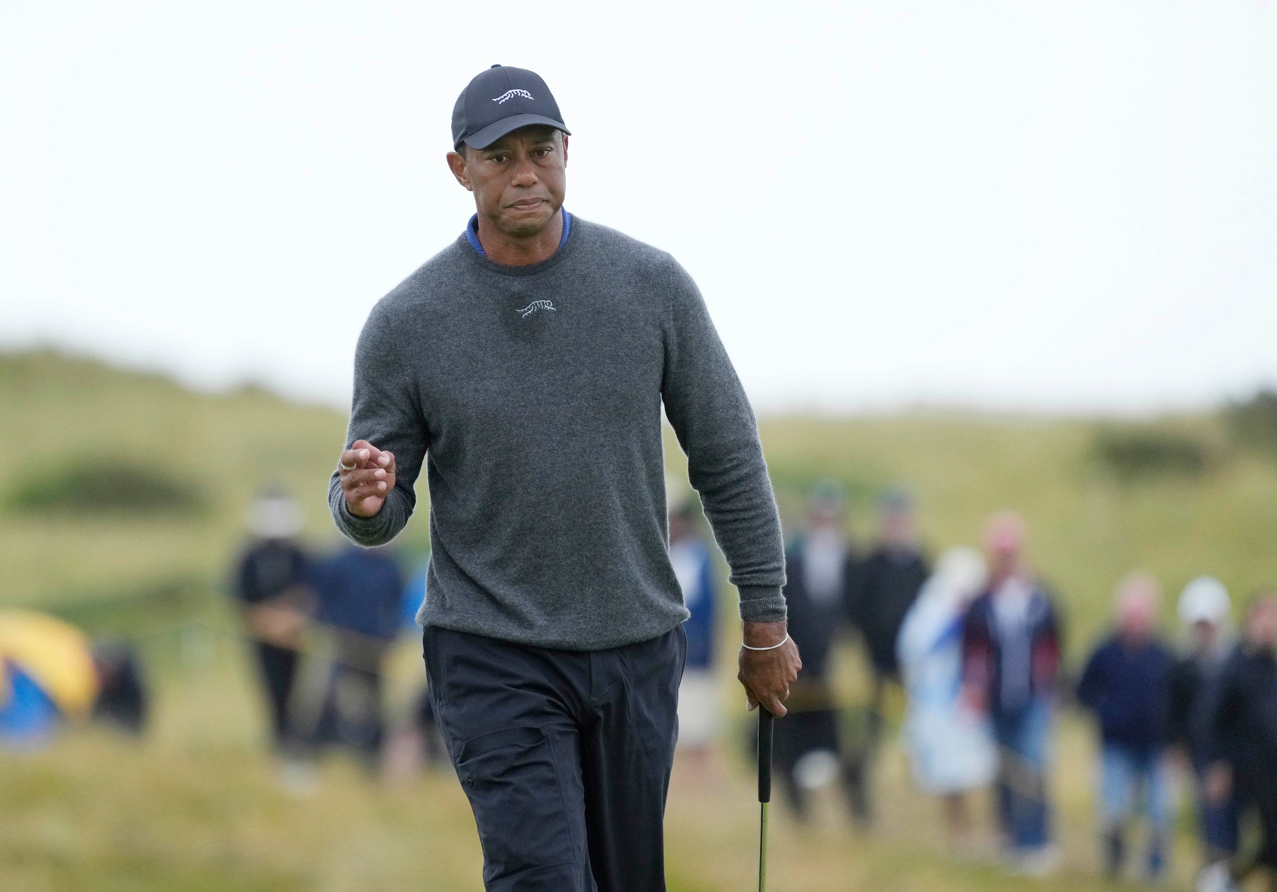 Tiger Woods reacts after putting on the 13th green during the first round of the Open Championship. (Image Source: Imagn)