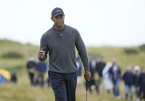 Tiger Woods reacts after putting on the 13th green during the first round of the Open Championship. (Image Source: Imagn)