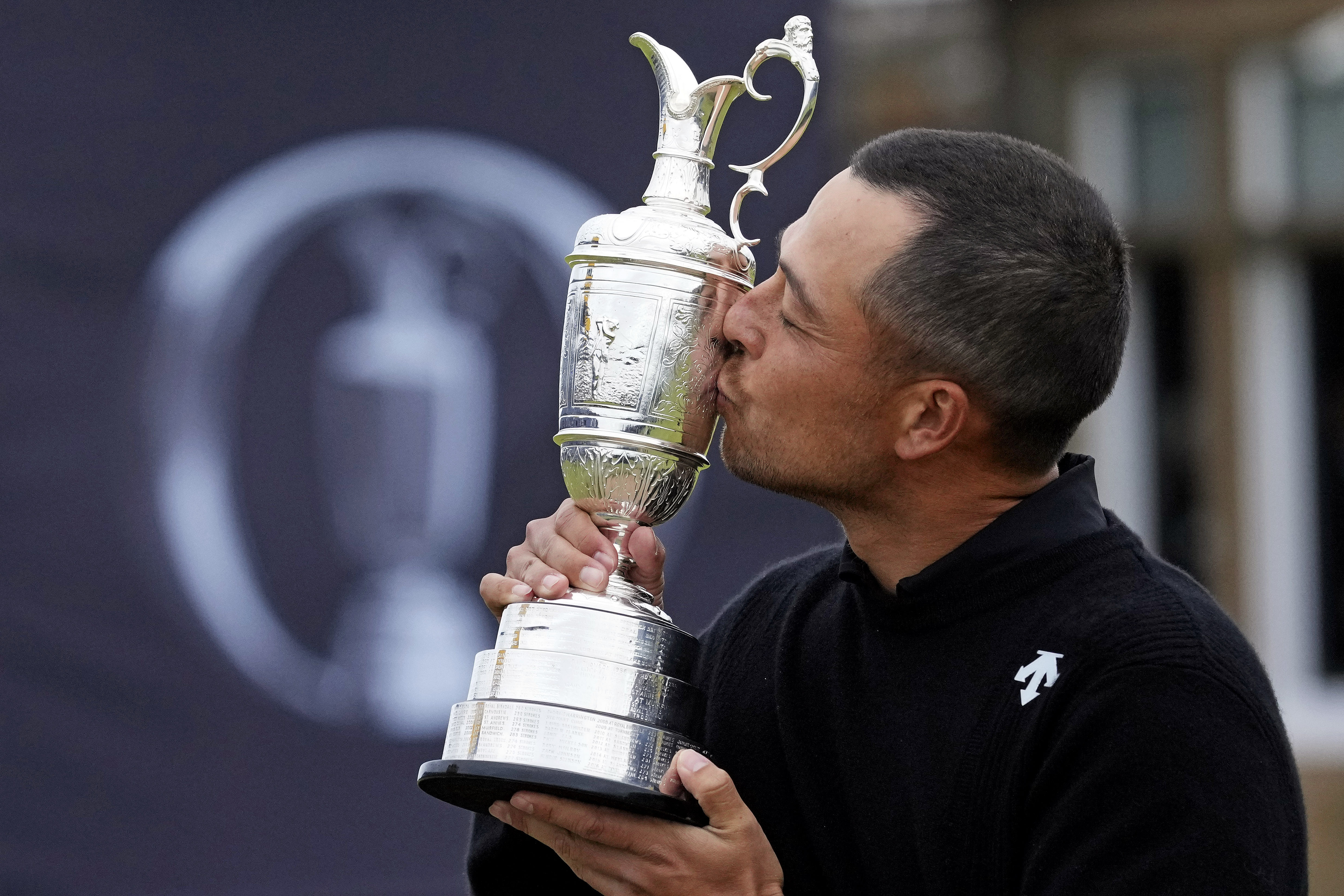 Xander Schauffele kisses the trophy after winning the Open Championship. (Image Source: Imagn)