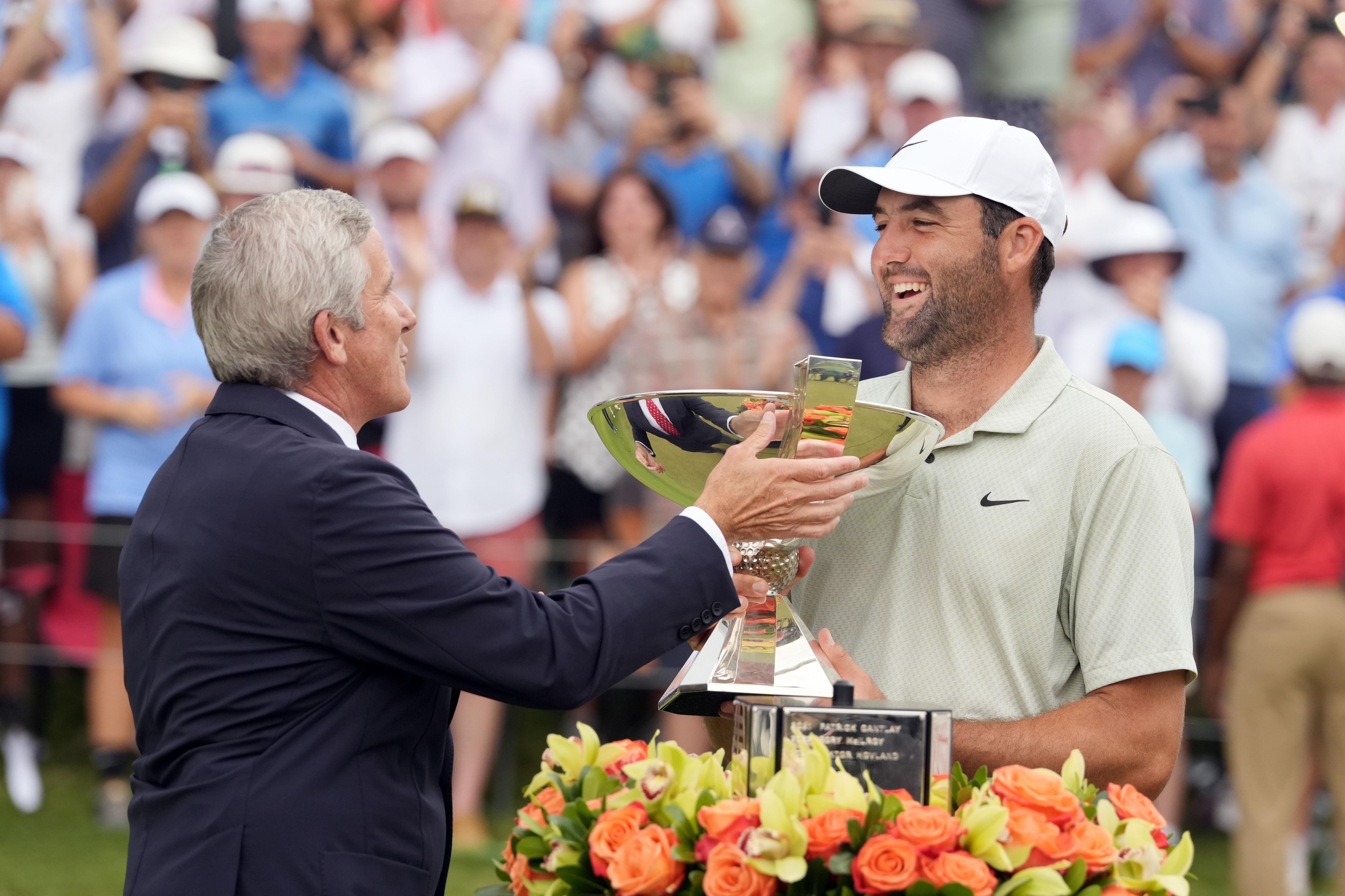 PGA TOUR Commissioner Jay Monahan presents the FedEx Cup to Scottie Scheffler (R) - Source: Imagn