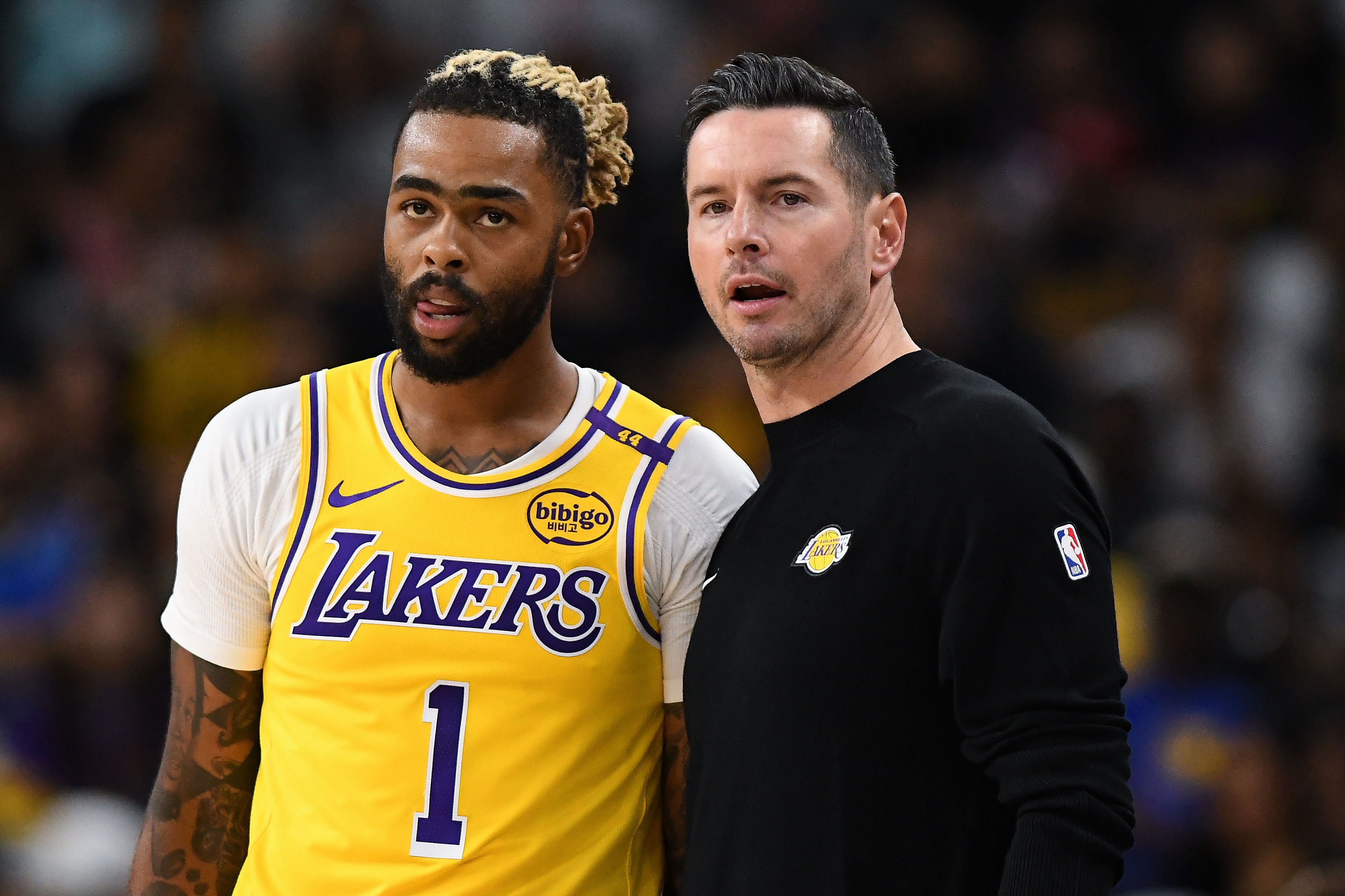 Los Angeles Lakers head coach JJ Redick talks to guard D&#039;Angelo Russell against the Minnesota Timberwolves during the first half at Acrisure Arena. Mandatory Credit: Jonathan Hui-Imagn Images