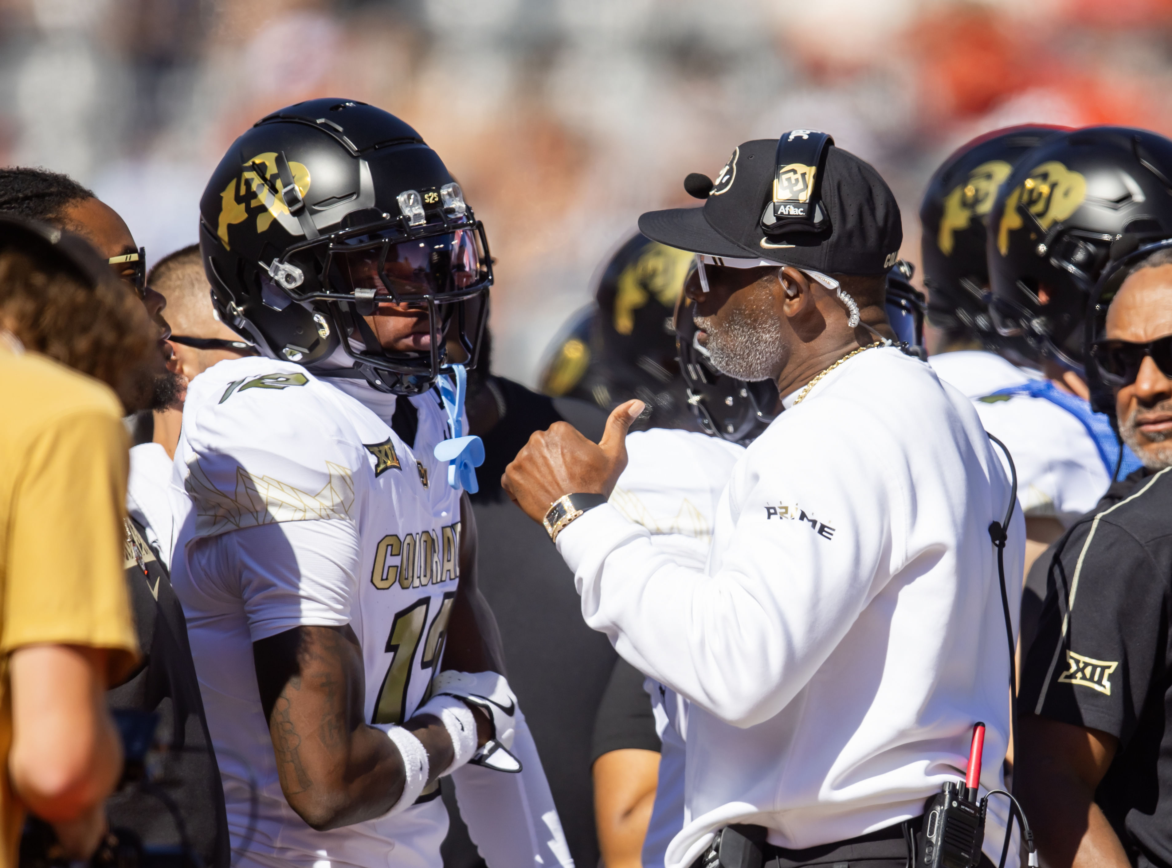 Colorado Buffaloes CB Travis Hunter gets instructions from coach Deion Sanders. (Credits: IMAGN)