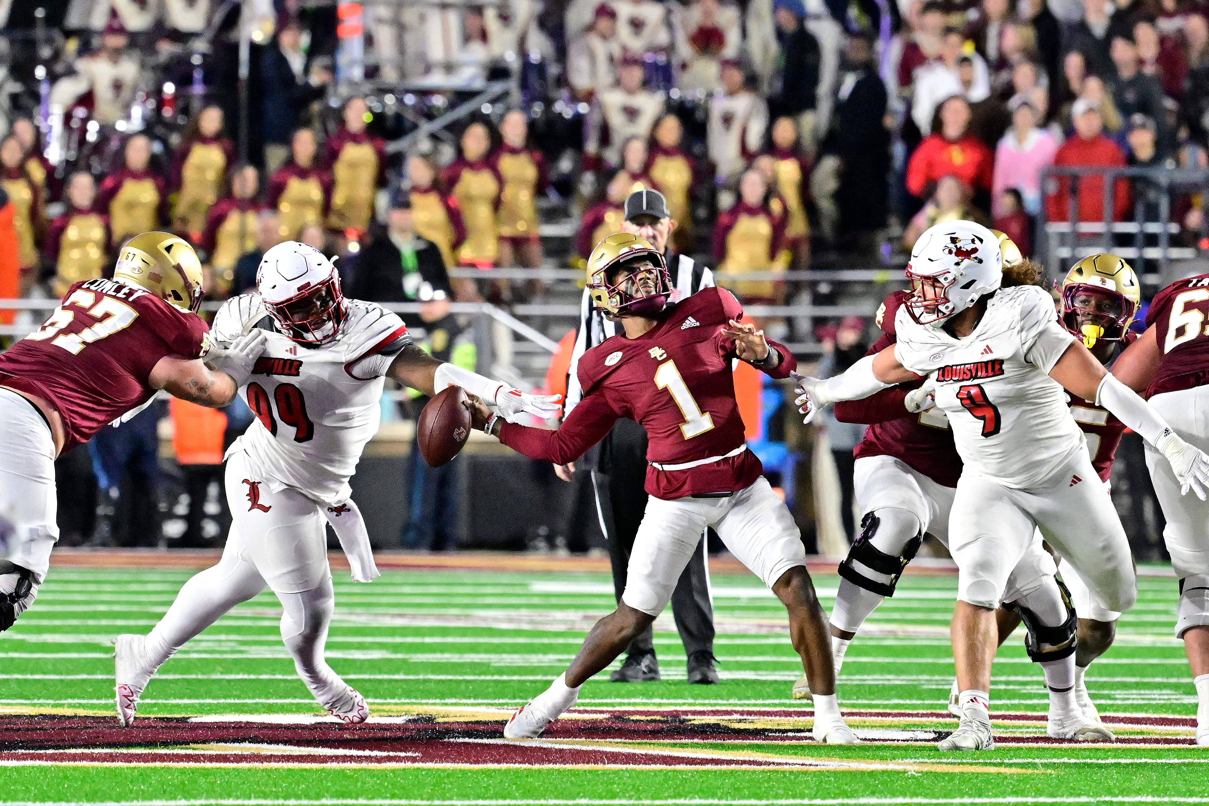 Louisville Cardinals defensive lineman Dezmond Tell (99) blocks the arm of Boston College Eagles quarterback Thomas Castellanos (1) (Image Source: IMAGN)