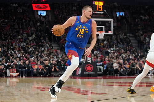 Denver Nuggets center Nikola Jokic dribbles the ball against the Toronto Raptors at Scotiabank Arena. Photo Credit: Imagn