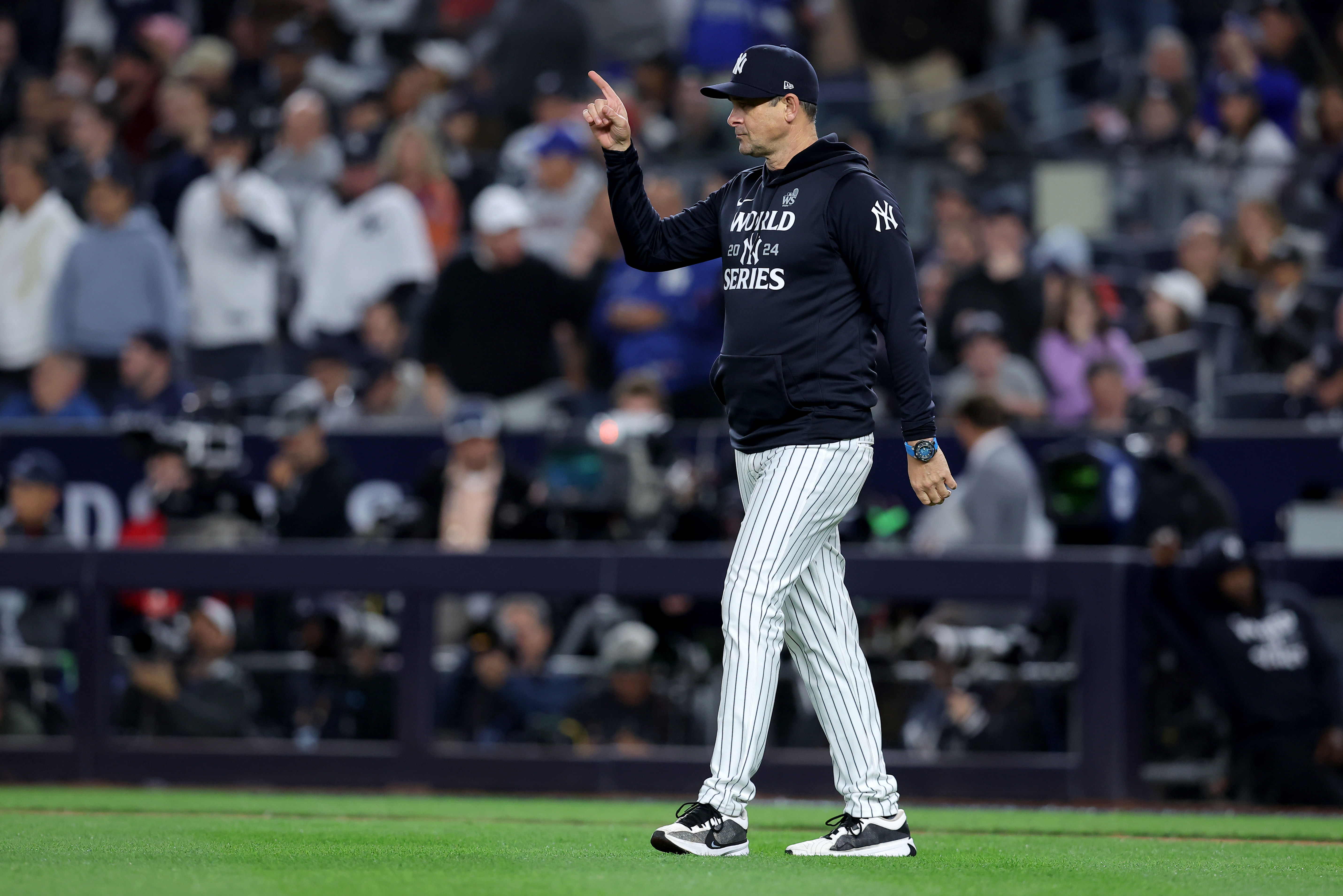 Aaron Boone is back with the Yankees (Imagn)