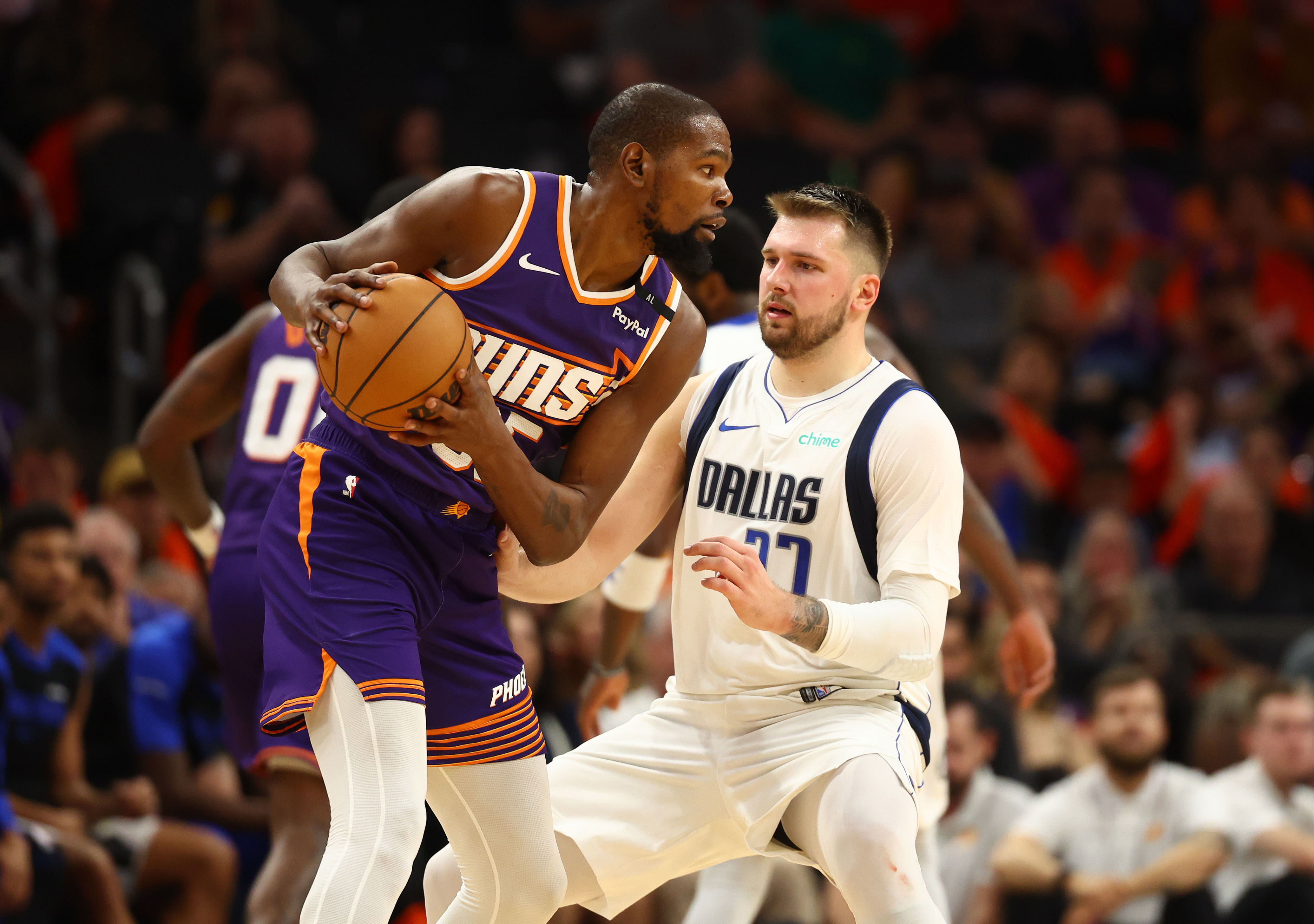 Dallas Mavericks guard Luka Doncic against Phoenix Suns forward Kevin Durant at Footprint Center. Photo Credit: Imagn