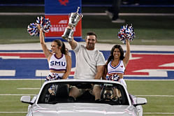 Bryson DeChambeau surprises fans with the US Open trophy at a college football game