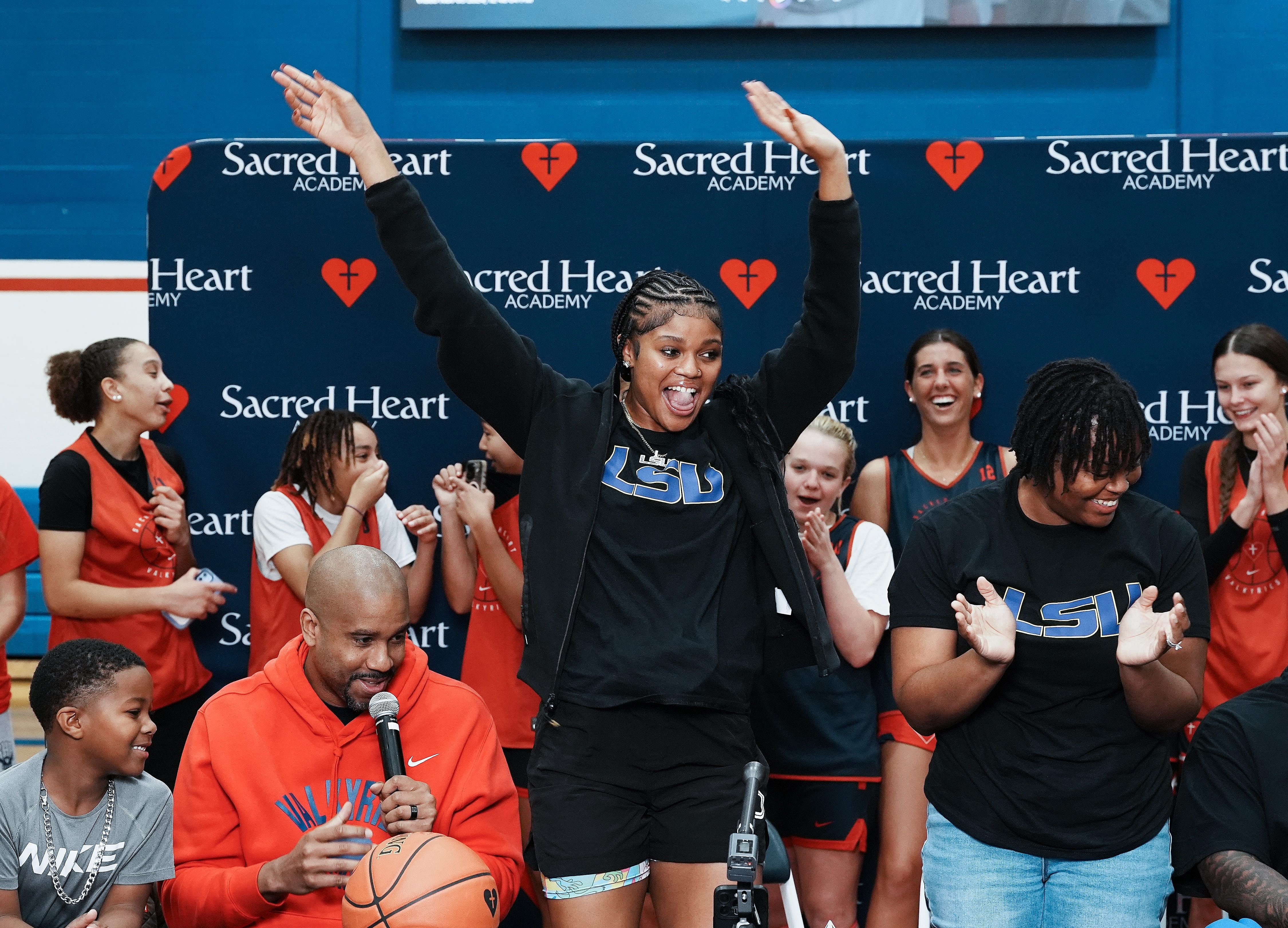 Sacred Heart basketball star ZaKiyah Johnson, center, after announcing her commitment to LSU during a ceremony at the Sacred Heart Academy. Photo Credit: Imagn