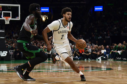 Brooklyn Nets forward Cameron Johnson controls the ball while Boston Celtics center Neemias Queta at TD Garden. Photo Credit: Imagn