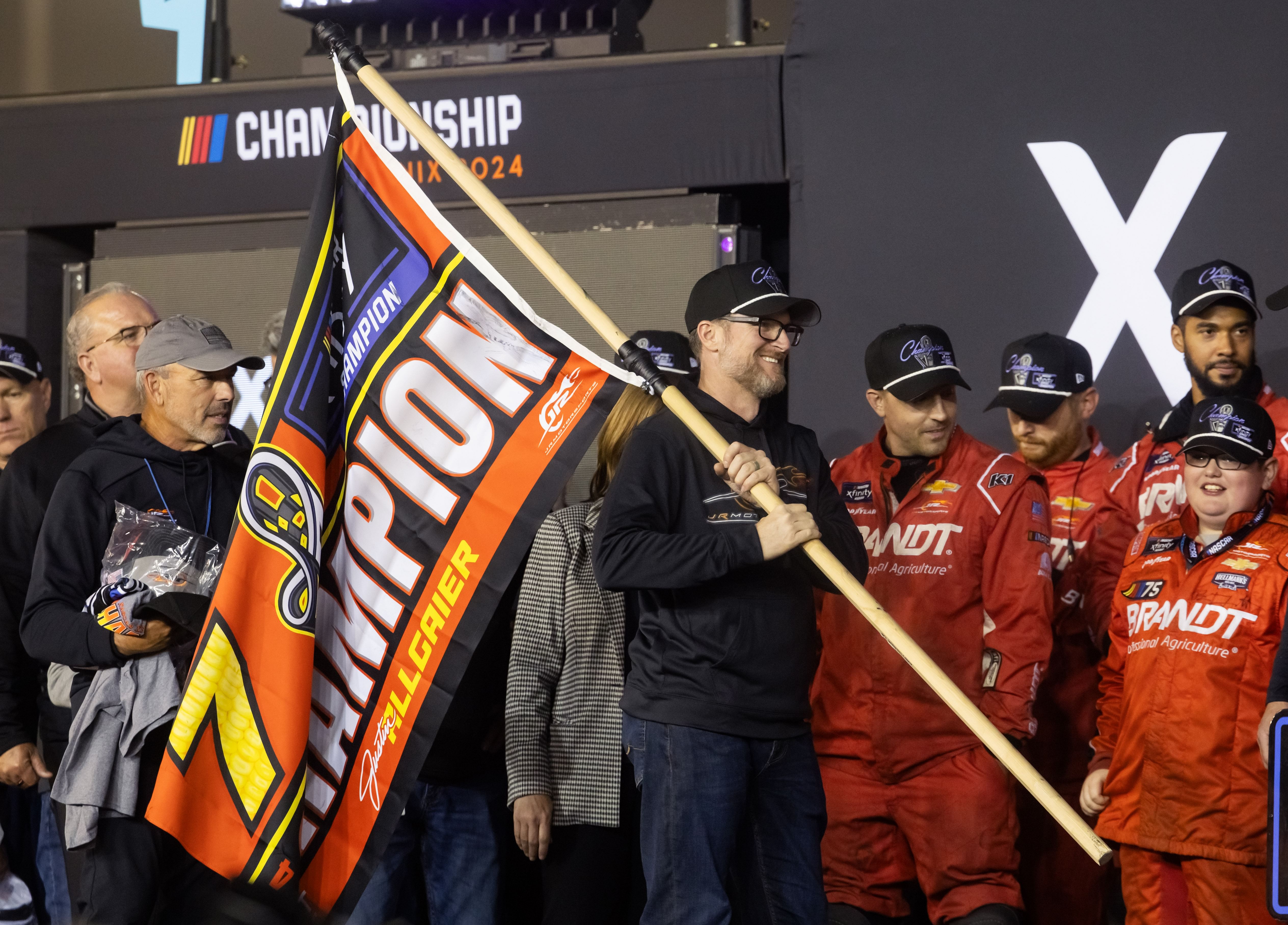 Dale Earnhardt Jr. celebrates after Justin Allgaier (not pictured) won the 2024 NASCAR Xfinity Series Championship - Source: Imagn