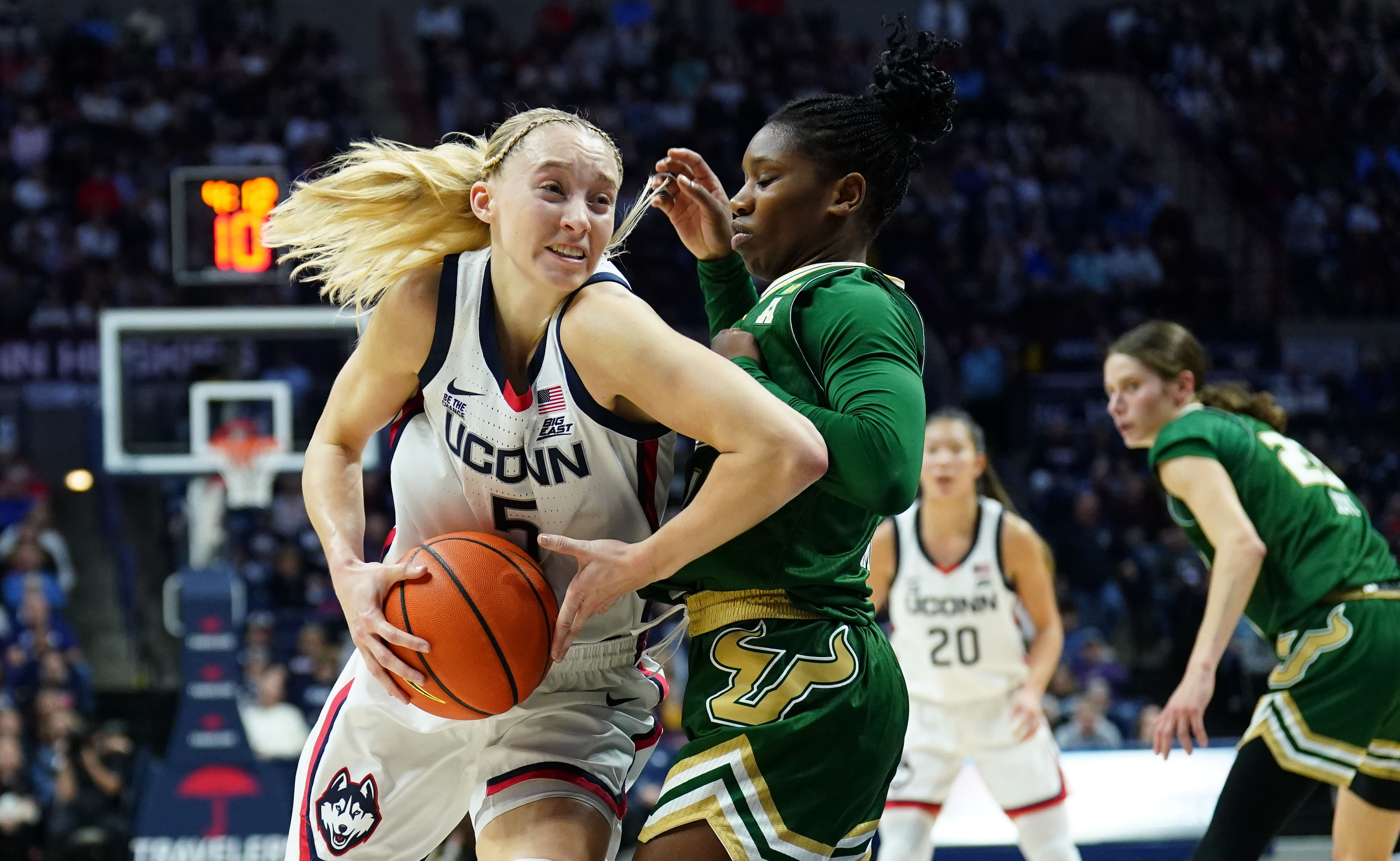 UConn guard Paige Bueckers drives the ball against South Florida&#039;s Mama Dembele. Photo: Imagn