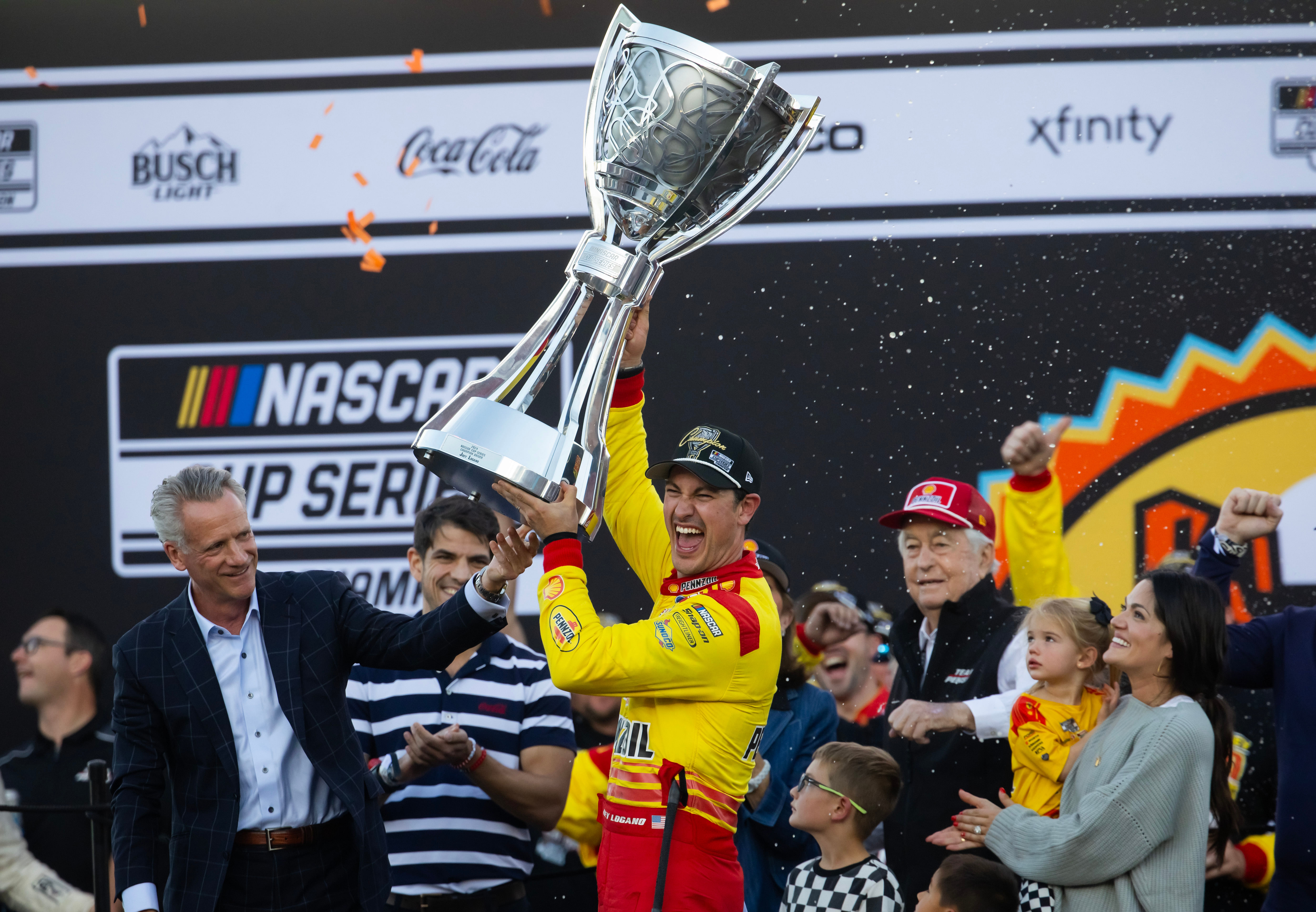 NASCAR Cup Series driver Joey Logano (right) is presented the Bill France Trophy by NASCAR president Steve Phelps - Source: Imagn