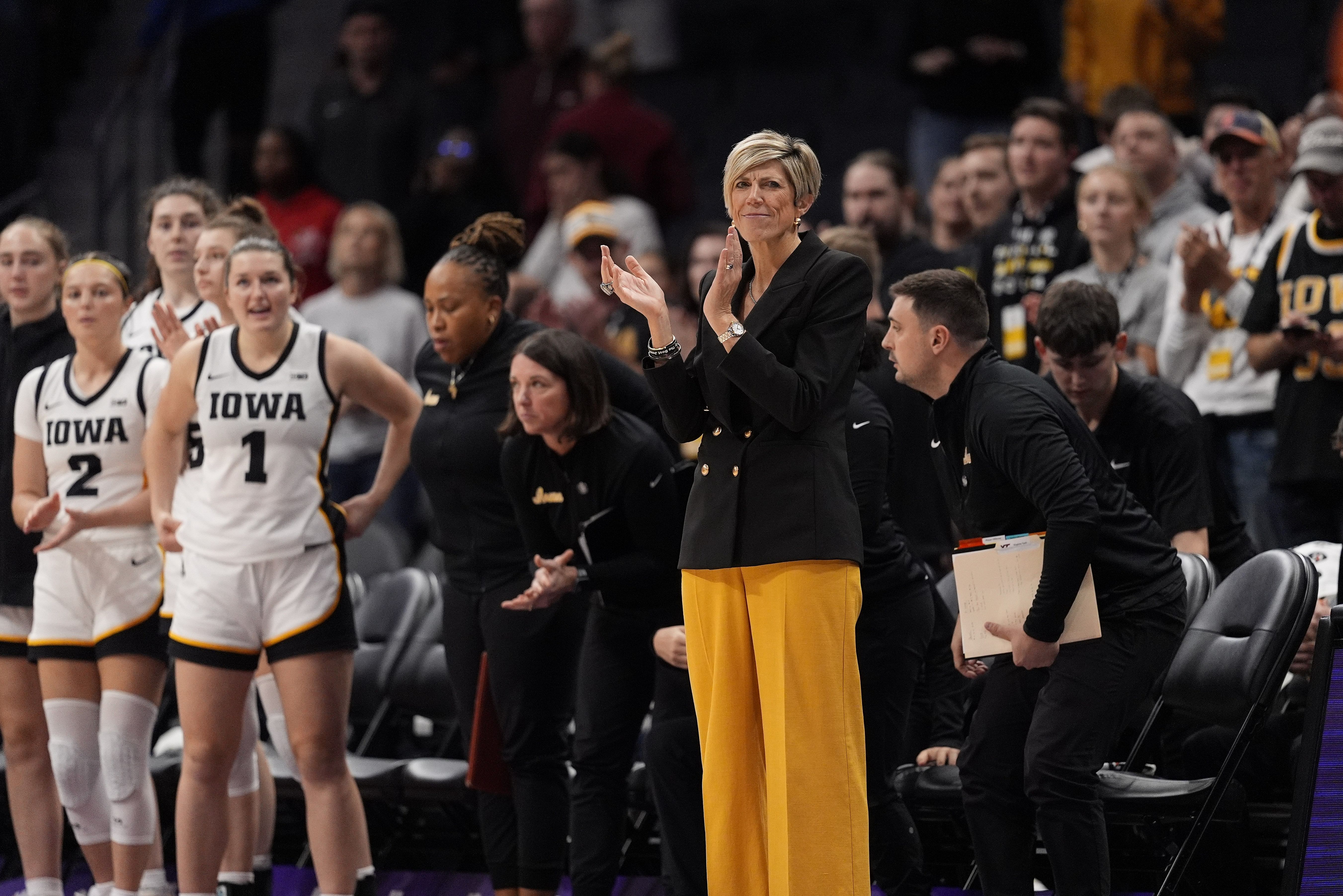 Iowa Hawkeyes coach Jan Jensen gestures during a game. (Credits: IMAGN)