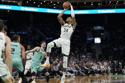 Milwaukee Bucks forward Giannis Antetokounmpo shoots a jumper against Charlotte Hornets guard LaMelo Ball at Spectrum Center. (Credits: IMAGN)