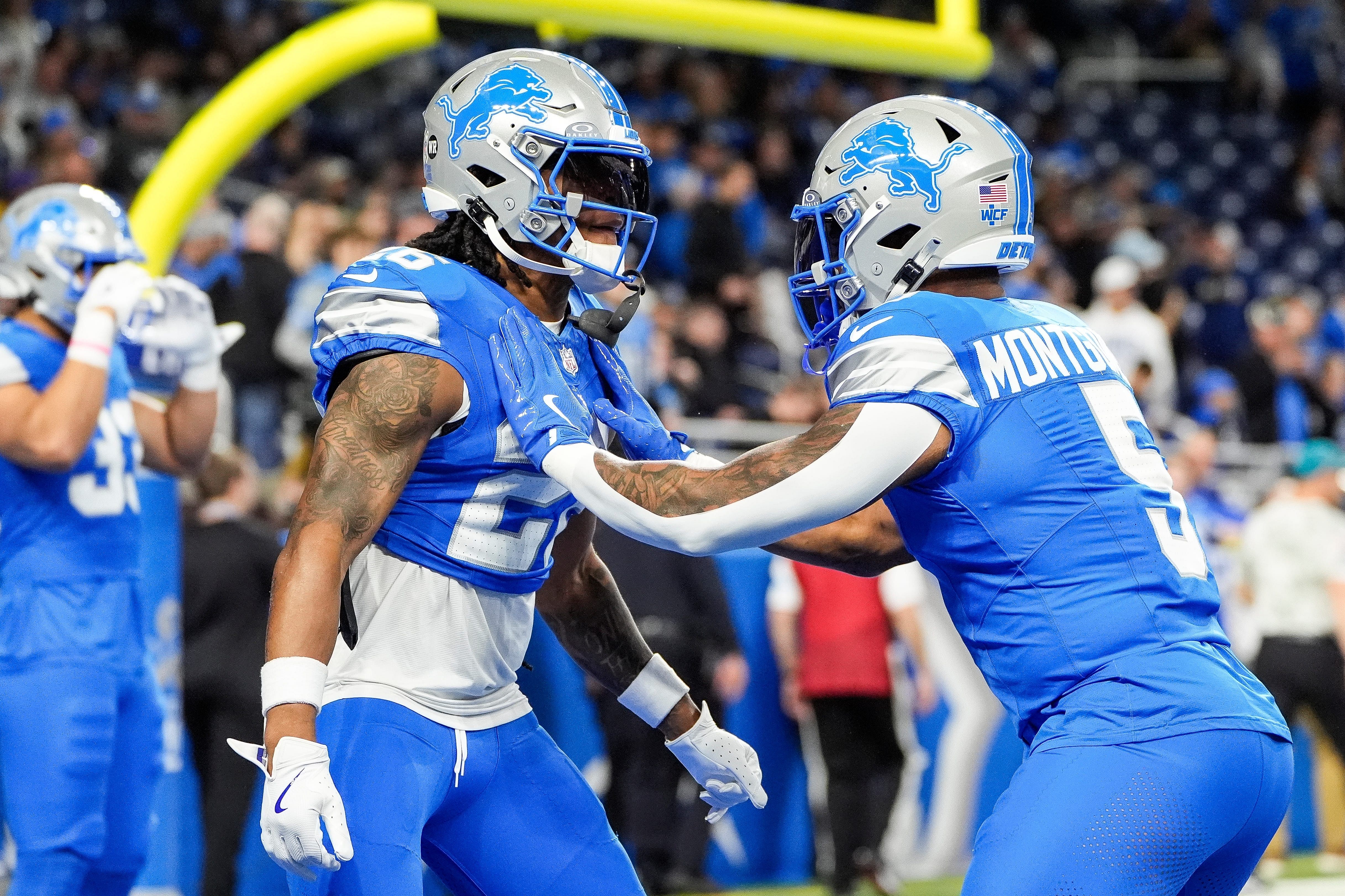 Detroit Lions running backs Jahmyr Gibbs (26) and David Montgomery (5) warm up before the Lions vs Jaguars game. (Credit: IMAGN)