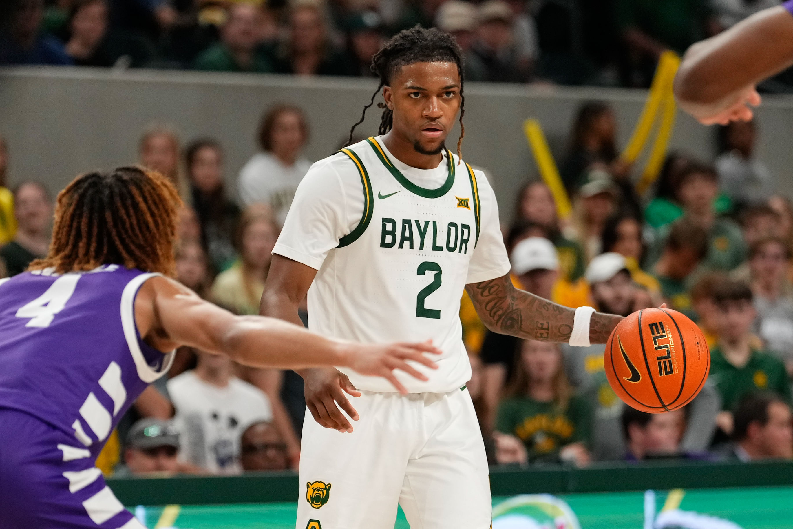 Baylor guard Jayden Nunn (2) controls the ball against Tarleton State guard Jordan Mizell (4) during the second half of their NCAA basketball game. Photo: Imagn