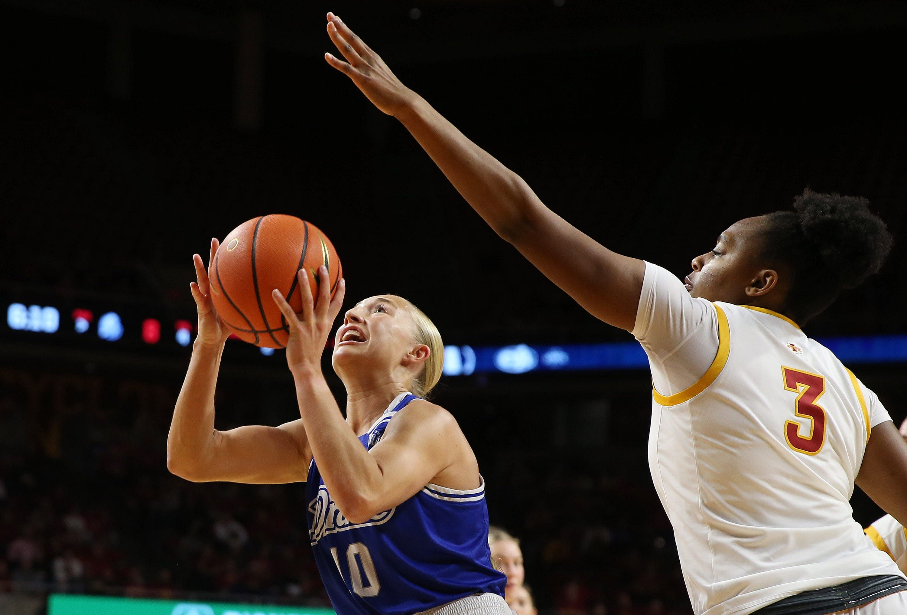 Drake Bulldogs guard Katie Dinnebier (10) takes a shot around Iowa State Cyclones' forward Alisa Williams (3) during the first quarter. Photo: Imagn