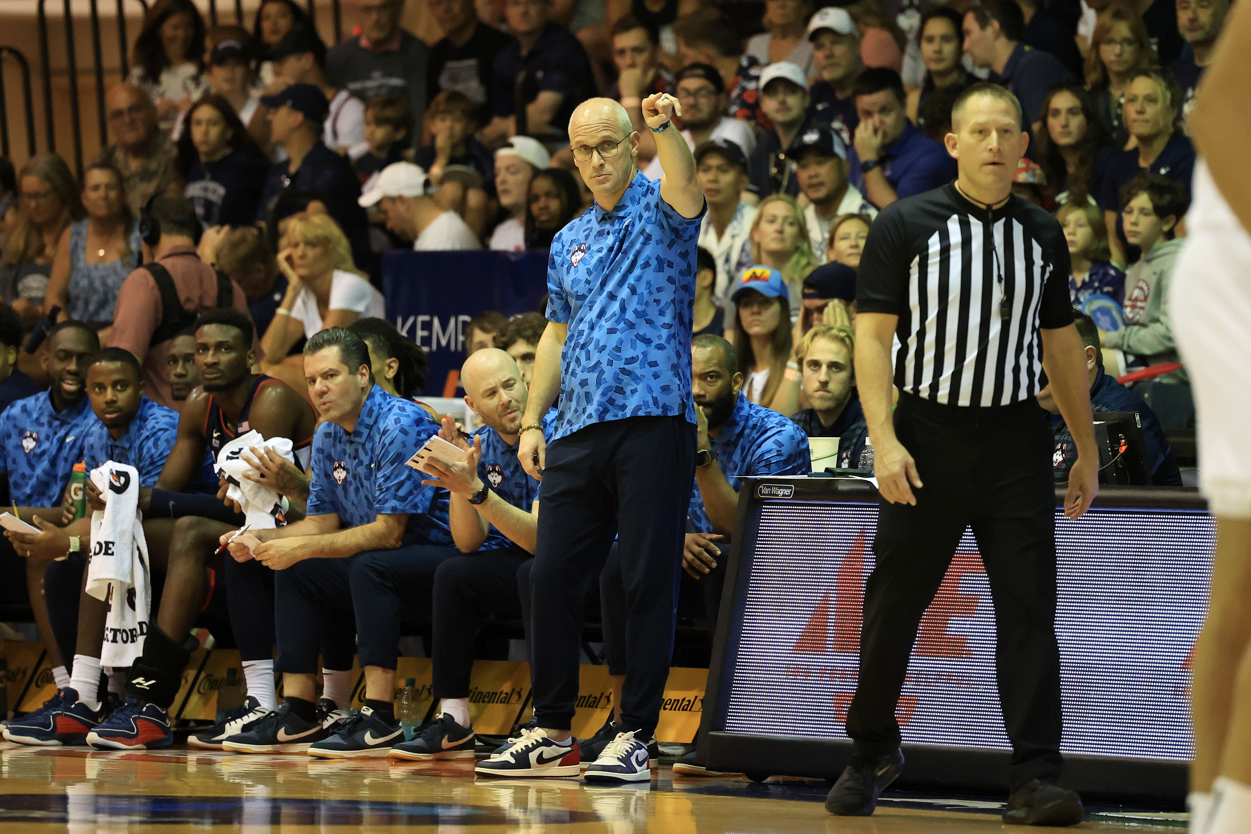 WATCH: Fuming Dan Hurley gets held back by UConn asst. coach