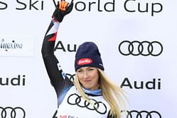 Mikaela Shiffrin shows off her celebration after winning the 98th World Cup Title of her career