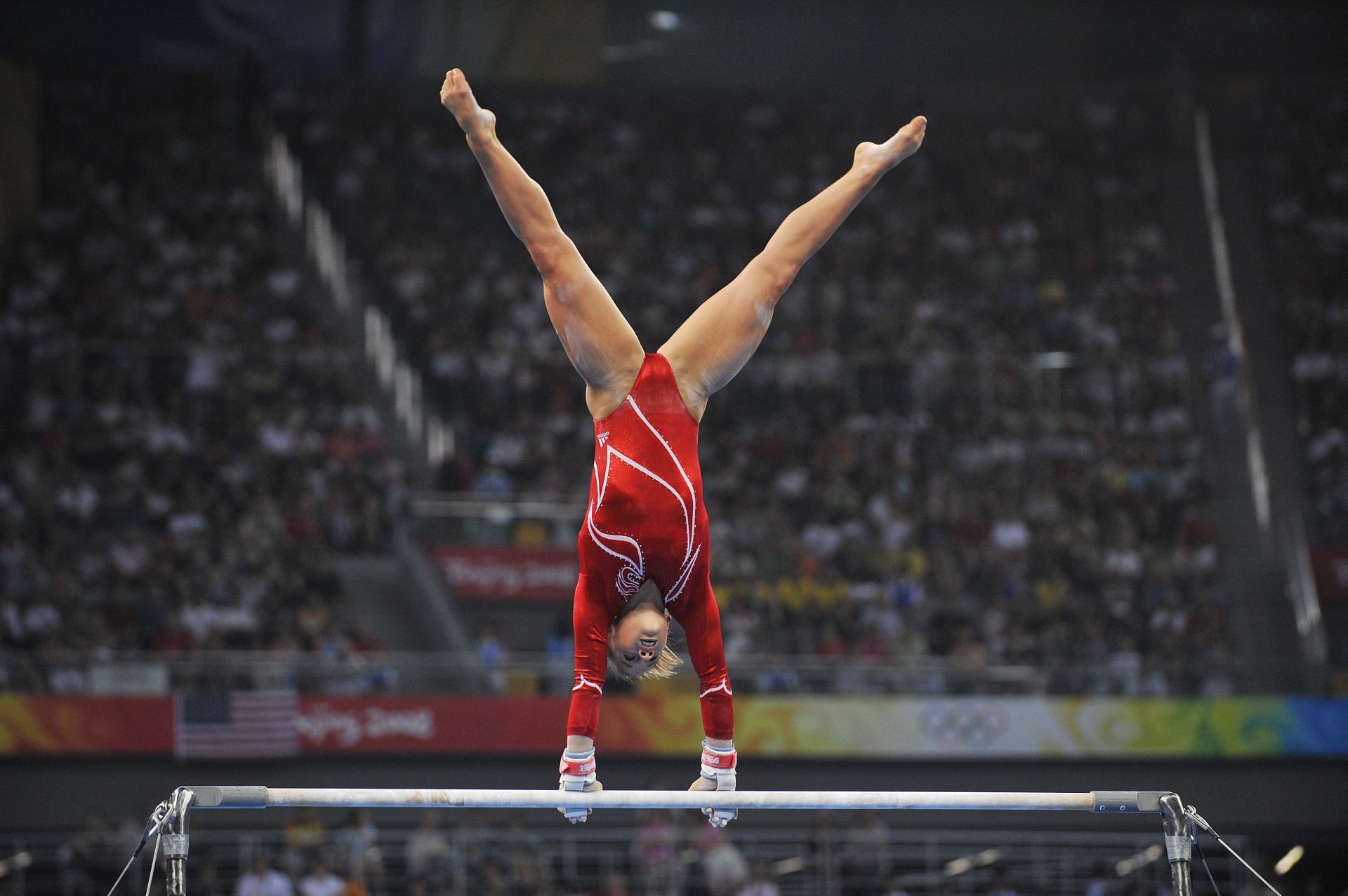 Former American gymnast Shawn Johnson performs her uneven bars routine in the Women&#039;s Team Finals at the National Indoor Stadium during the 2008 Summer Olympics in Beijing, Japan. (Photo via Getty Images)